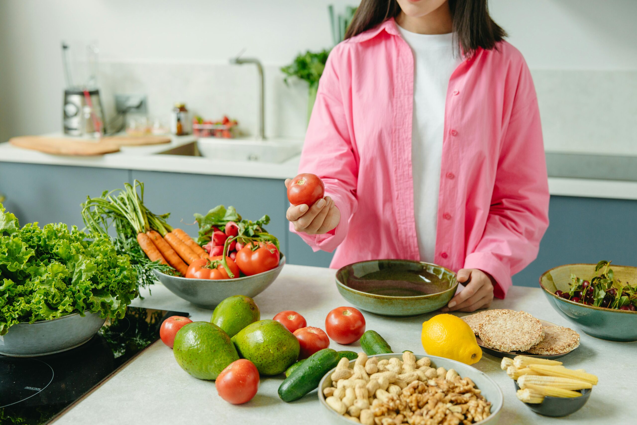 best foods for gut health women colorful bowl with vegetables, yogurt, and avocado