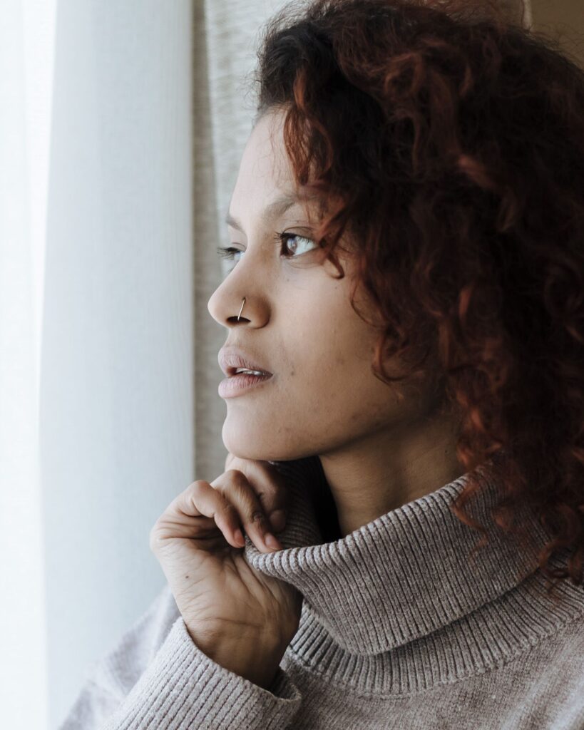 Woman reflecting on the causes of chronic bloating