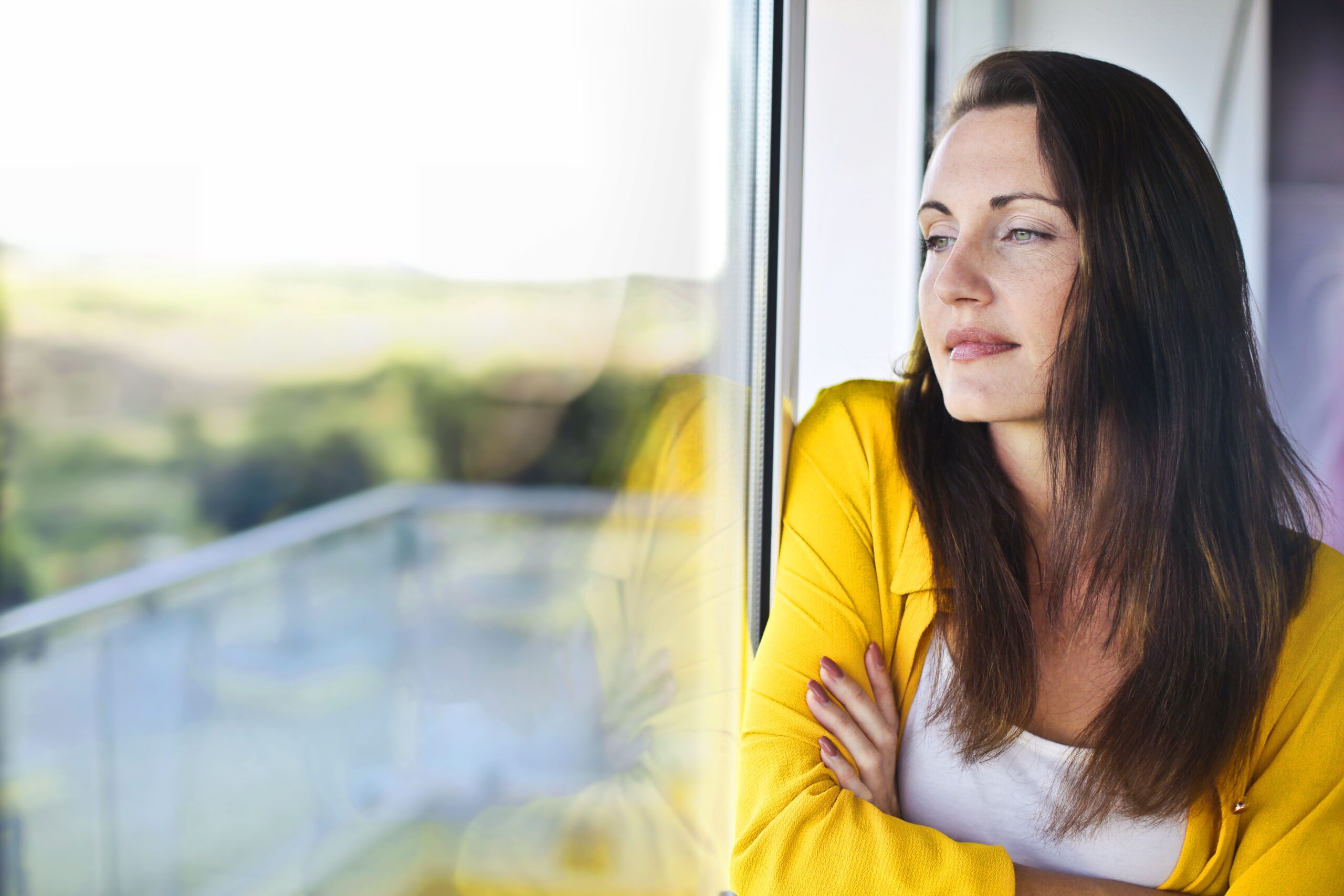Woman holding stomach from perimenopause bloating and gas